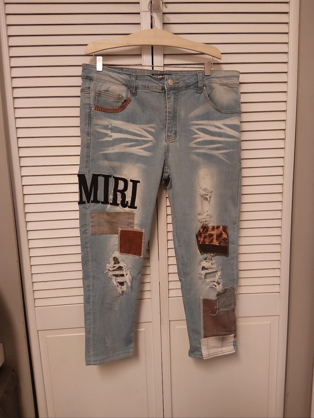 AMIRI Light Blue Distressed Jeans with Patchwork